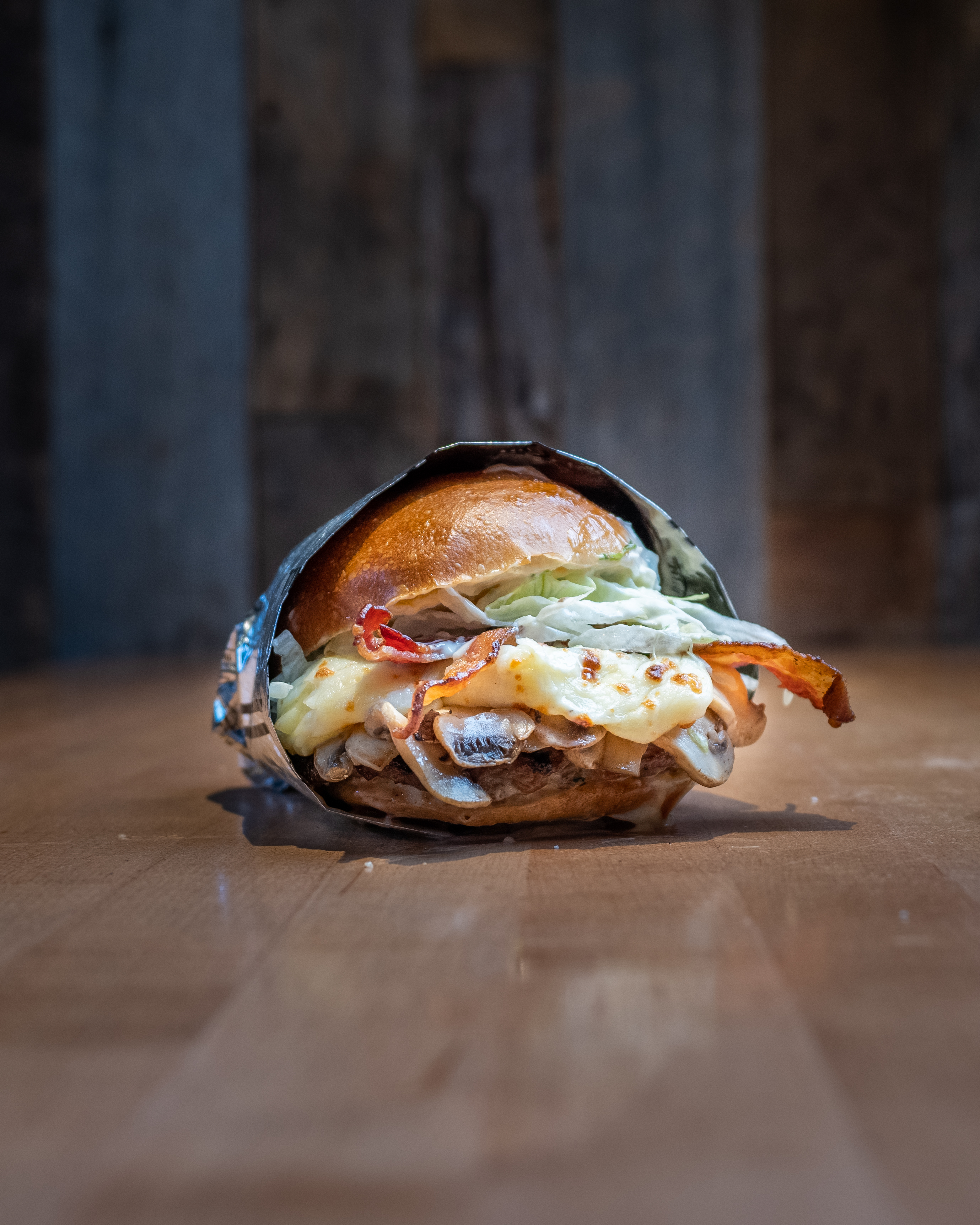 Mushroom Melt Burger - Fresh 1/3 lb halal beef patty on an Ace Bakery bri...